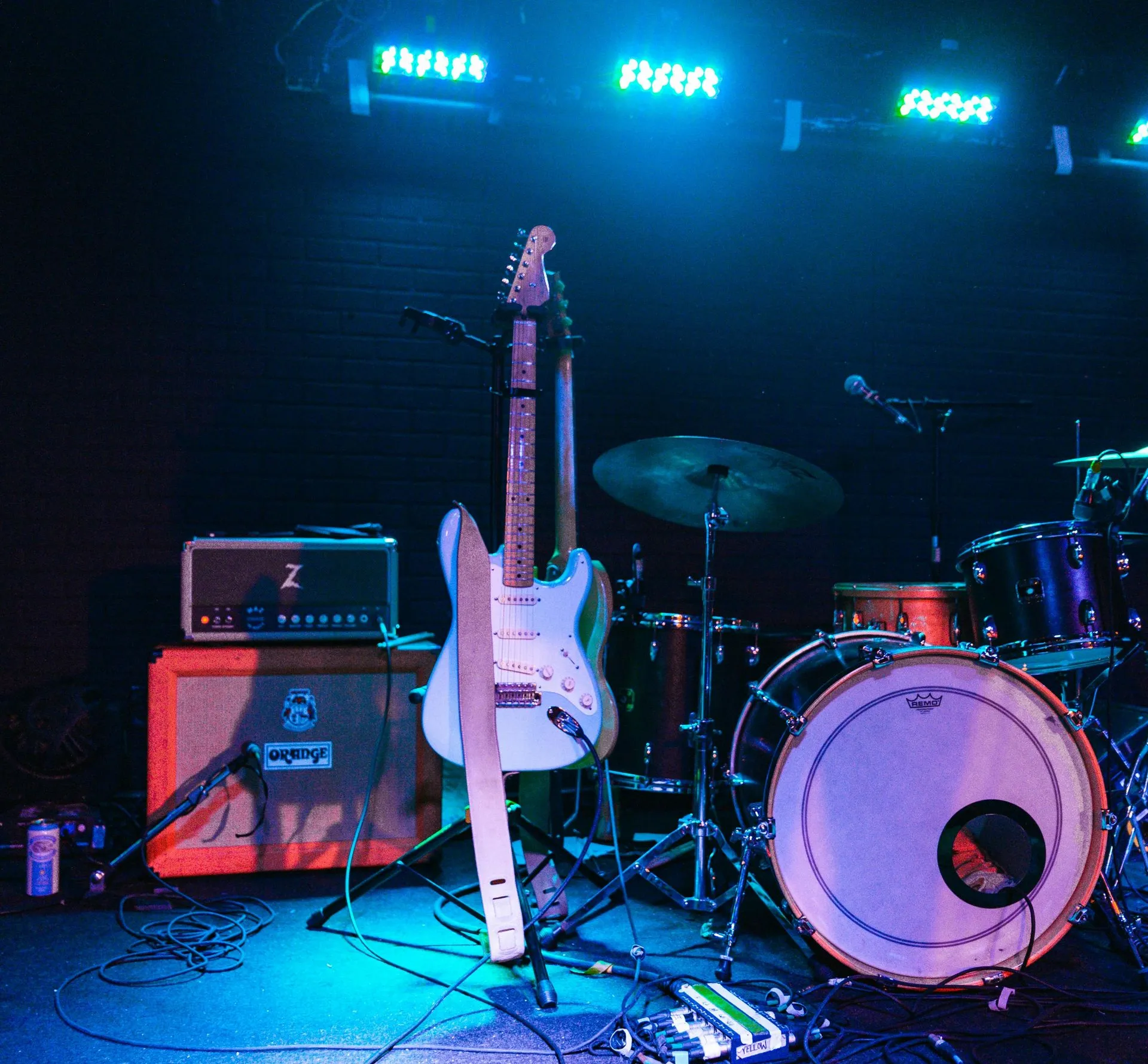 Guitar and drums on stage